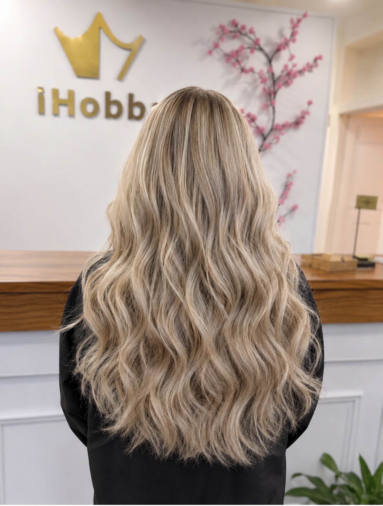 Finished iHobbs blonde extension result showing blend, movement and finish in the salon