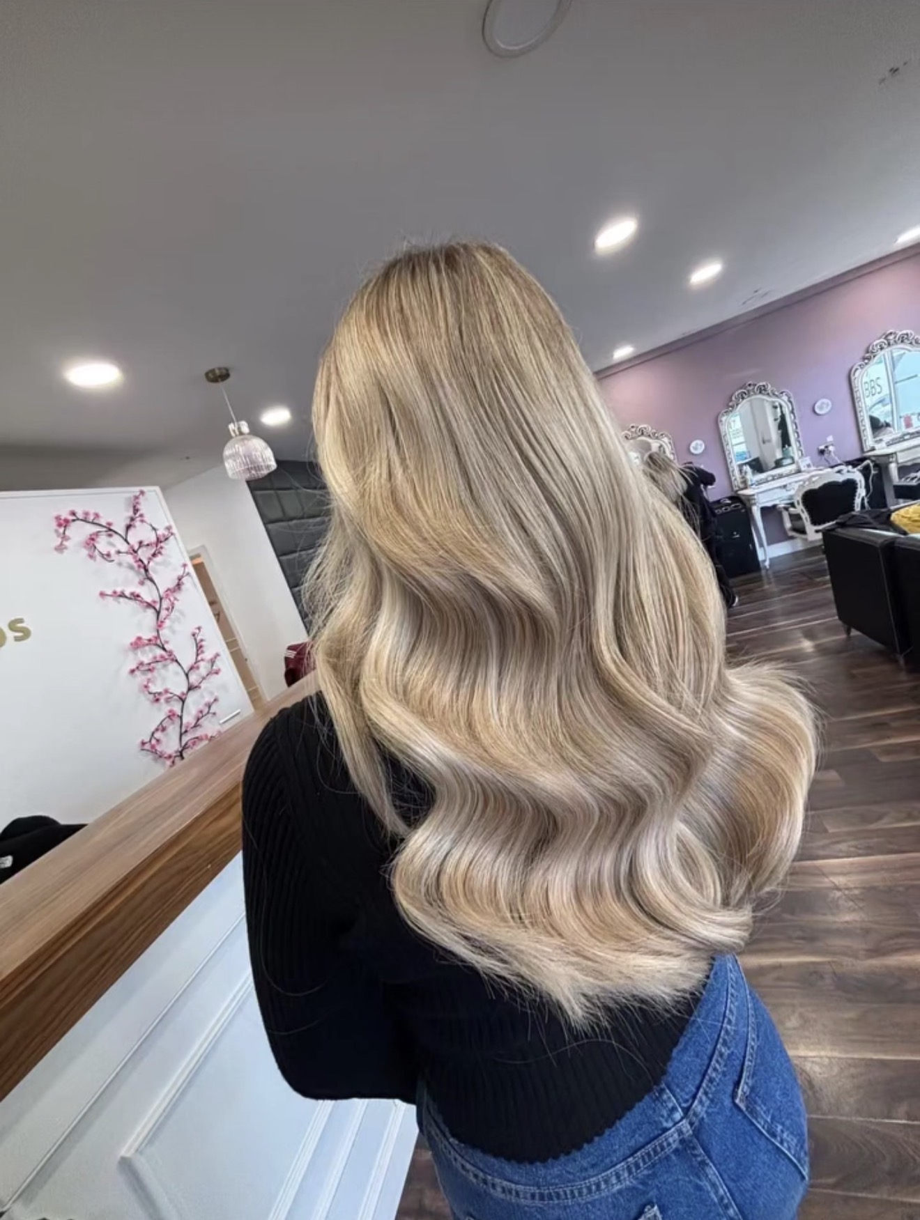 Finished iHobbs blonde hair extensions result with soft waves and blended tones